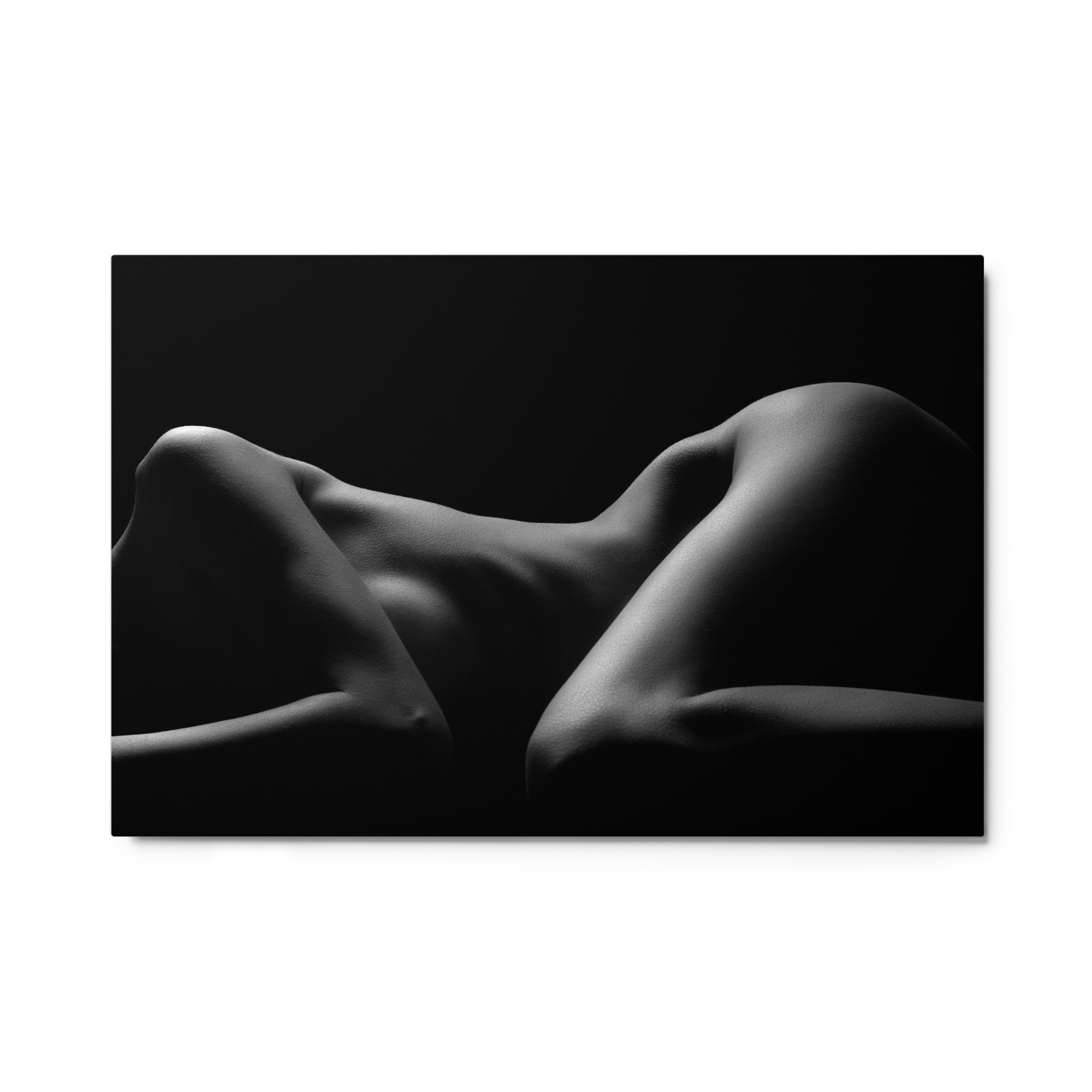 black and white photograph of a nude female form